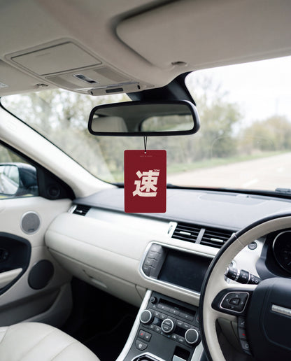JDM Spirit hanging from a car's rear-view mirror