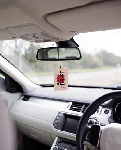 DR-FT hanging from a car's rear-view mirror