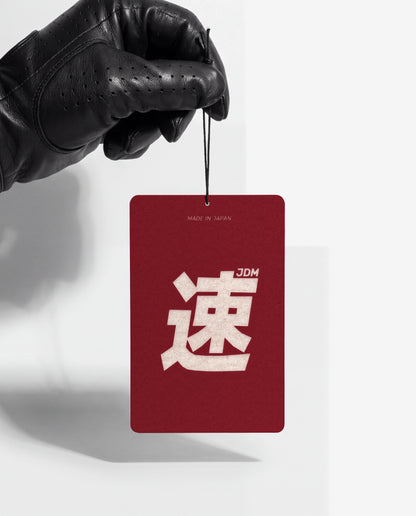 JDM Spirit card held by its string