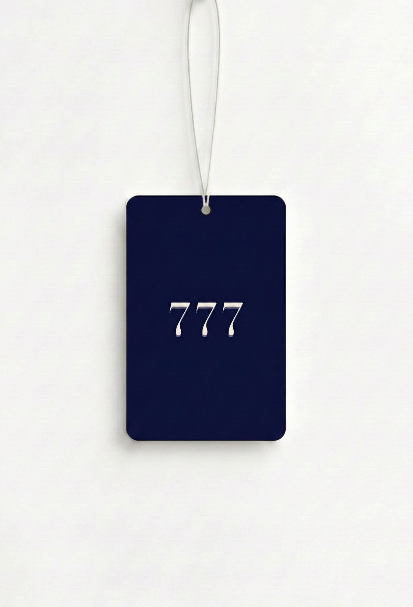 Navy blue luggage tag with '777' printed on it against a white background