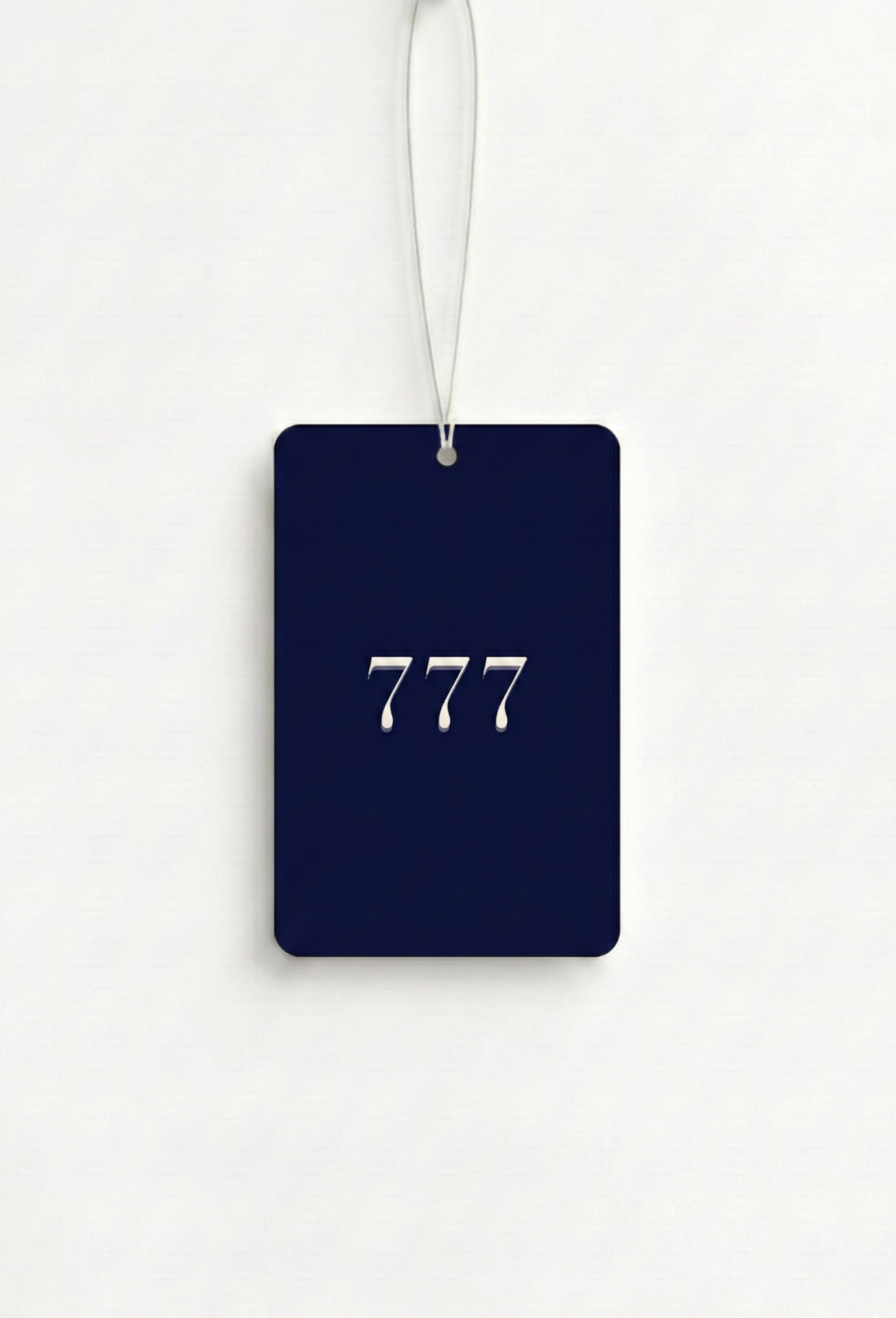 Navy blue luggage tag with '777' printed on it against a white background