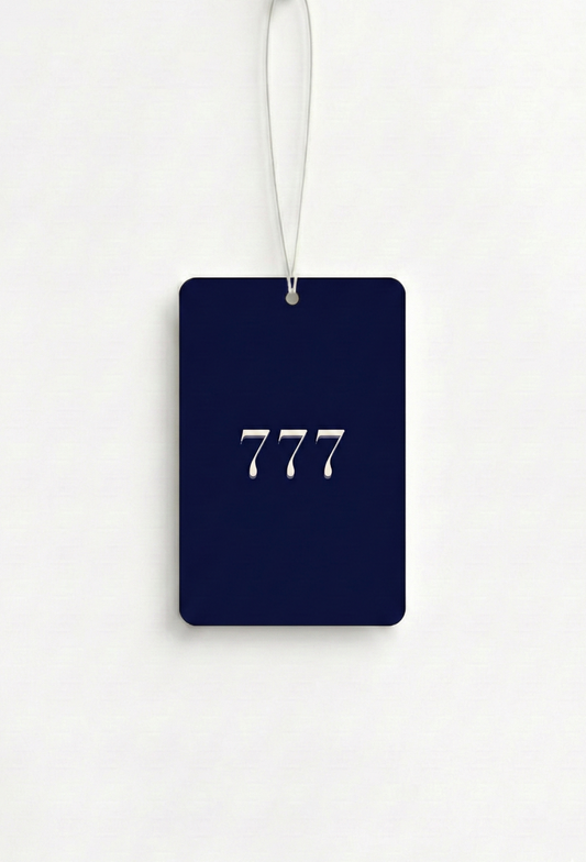 Navy blue luggage tag with '777' printed on it against a white background