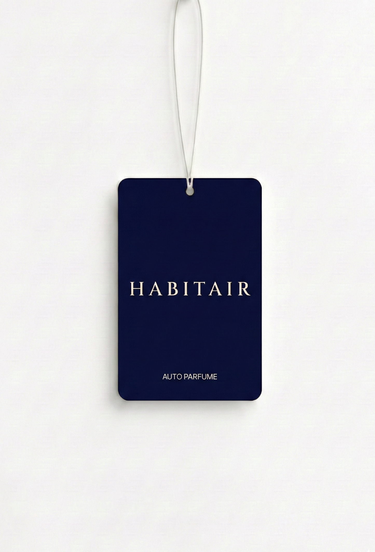 Navy blue air freshener tag with 'Habitair' branding on a white background