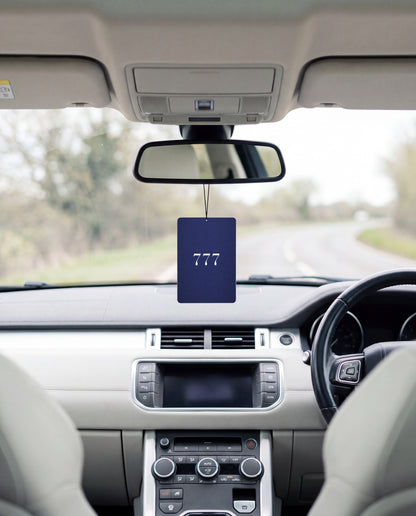 777 MOON RIDGE hanging from a car's rear-view mirror
