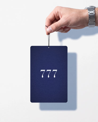777 MOON RIDGE card held by its string