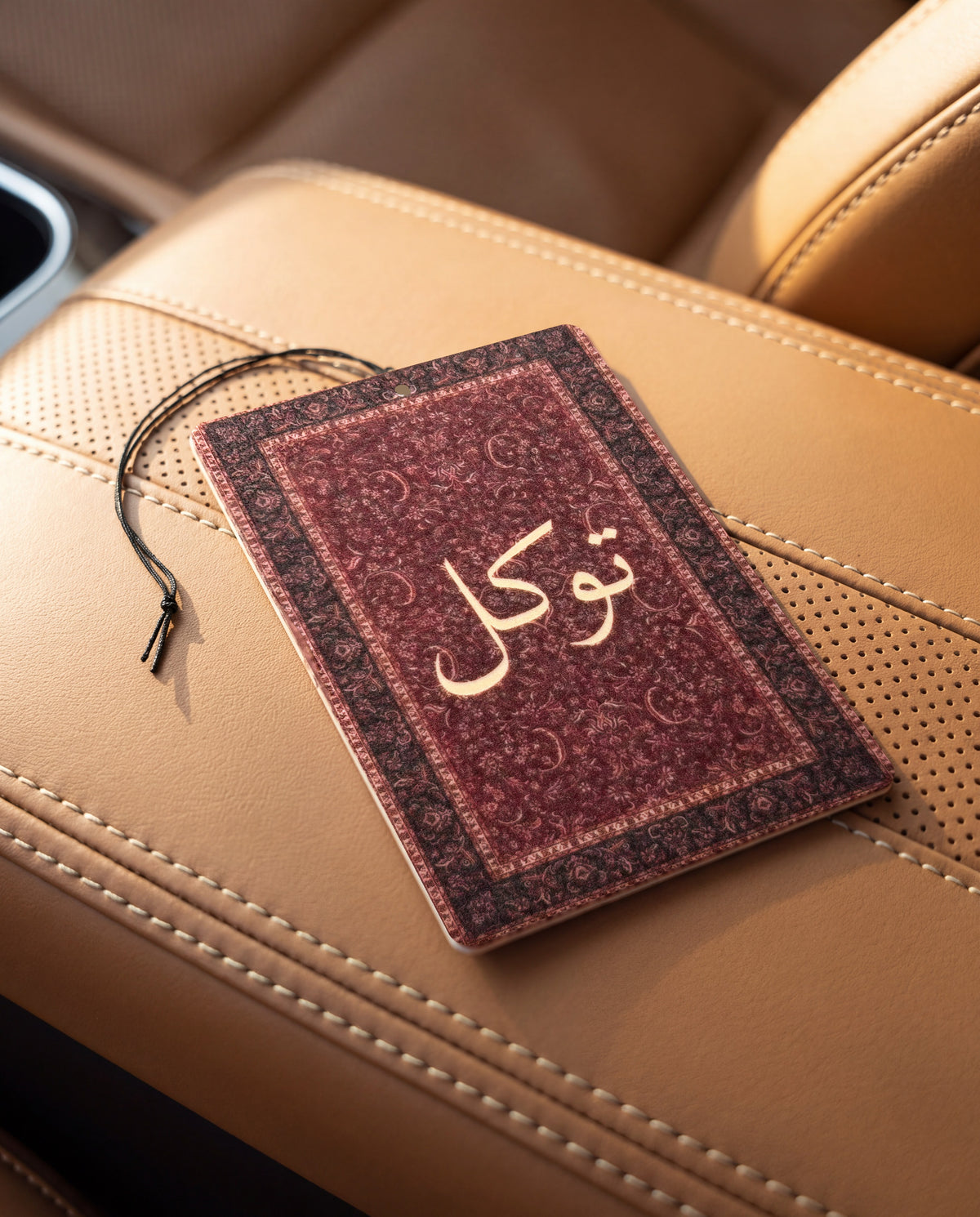 DESERT NOIR car air freshener card on a car interior detail