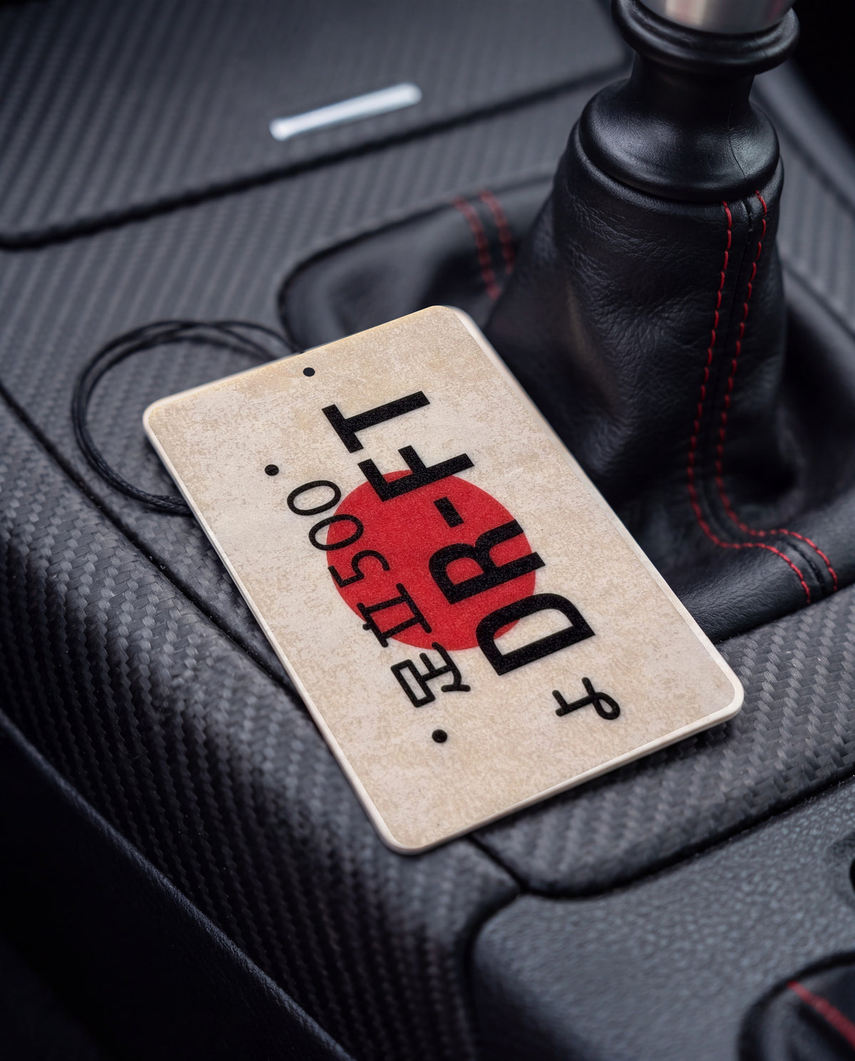 DR-FT car air freshener card on a car interior detail
