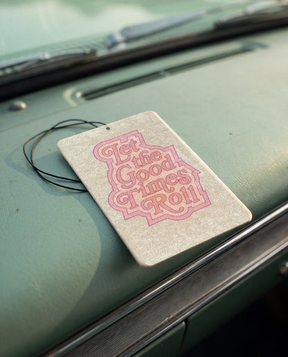 Let the Good Times Roll car air freshener card on a car interior detail