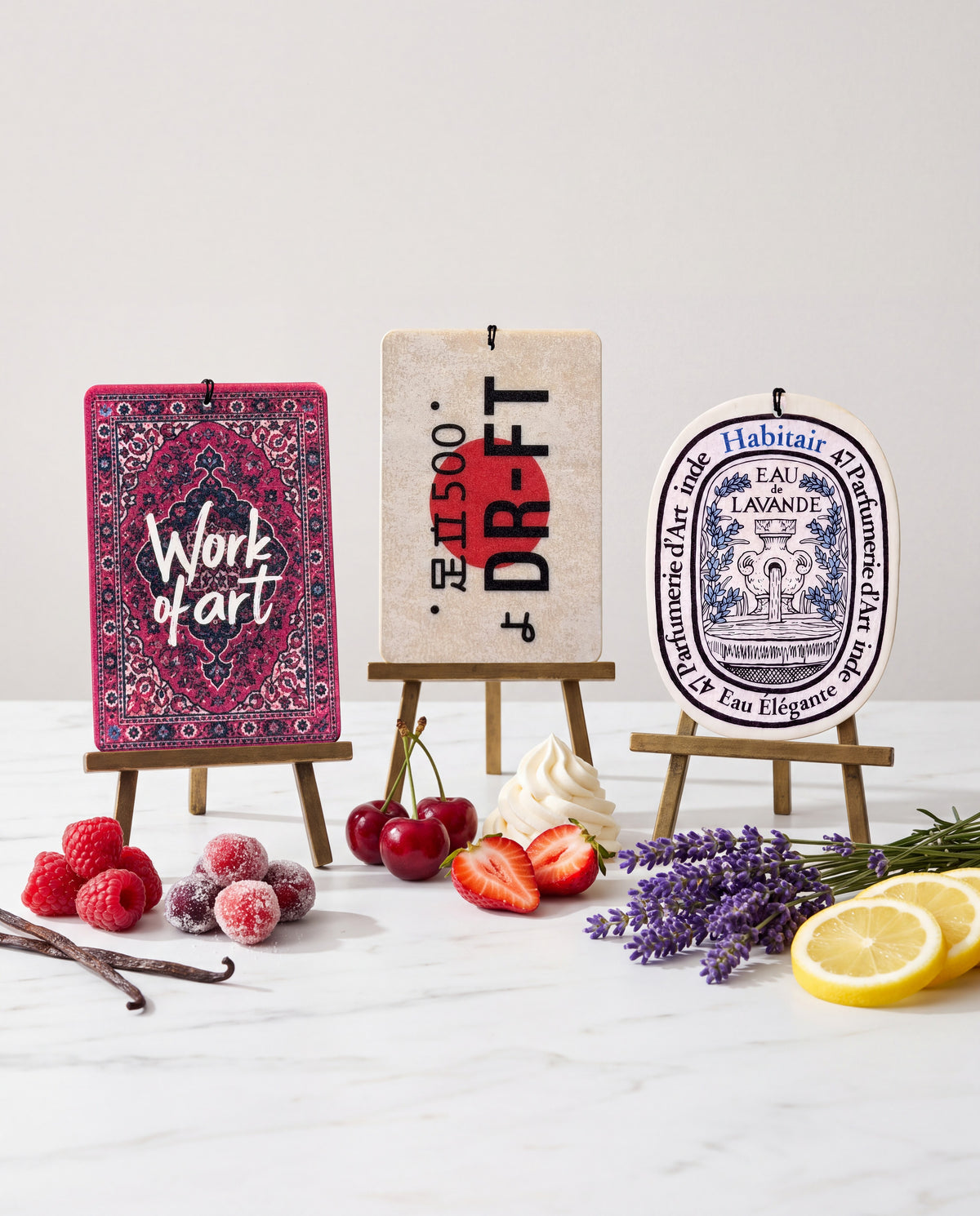 Habitair Trio: The Artisan Collection: Work of Art, DR-FT and Eau de Lavande car air freshener cards displayed with their scent ingredients