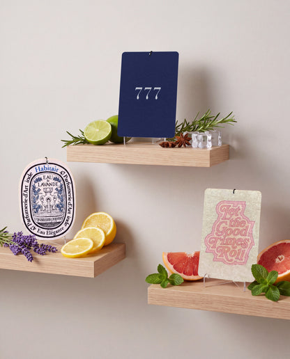 Habitair Trio: The Essentials Collection: Eau de Lavande, Lucky 777 and Let the Good Times Roll car air freshener cards displayed with their scent ingredients
