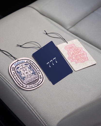 Habitair Trio: The Essentials Collection: Eau de Lavande, Lucky 777 and Let the Good Times Roll car air freshener cards on a car interior detail