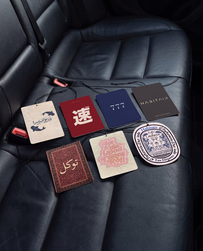 Habitair Ultimate Bundle – 7 Premium Car Air Fresheners: all seven HabitAir designs car air freshener cards on a car interior detail