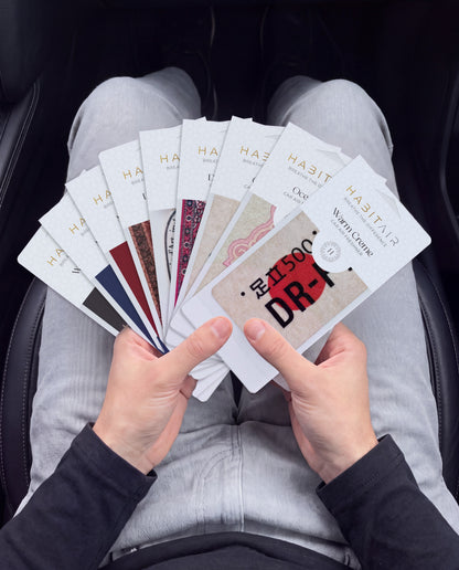THE ENTHUSIAST PACK 🔥: hand holding the all nine HabitAir cards HabitAir retail packs in a car